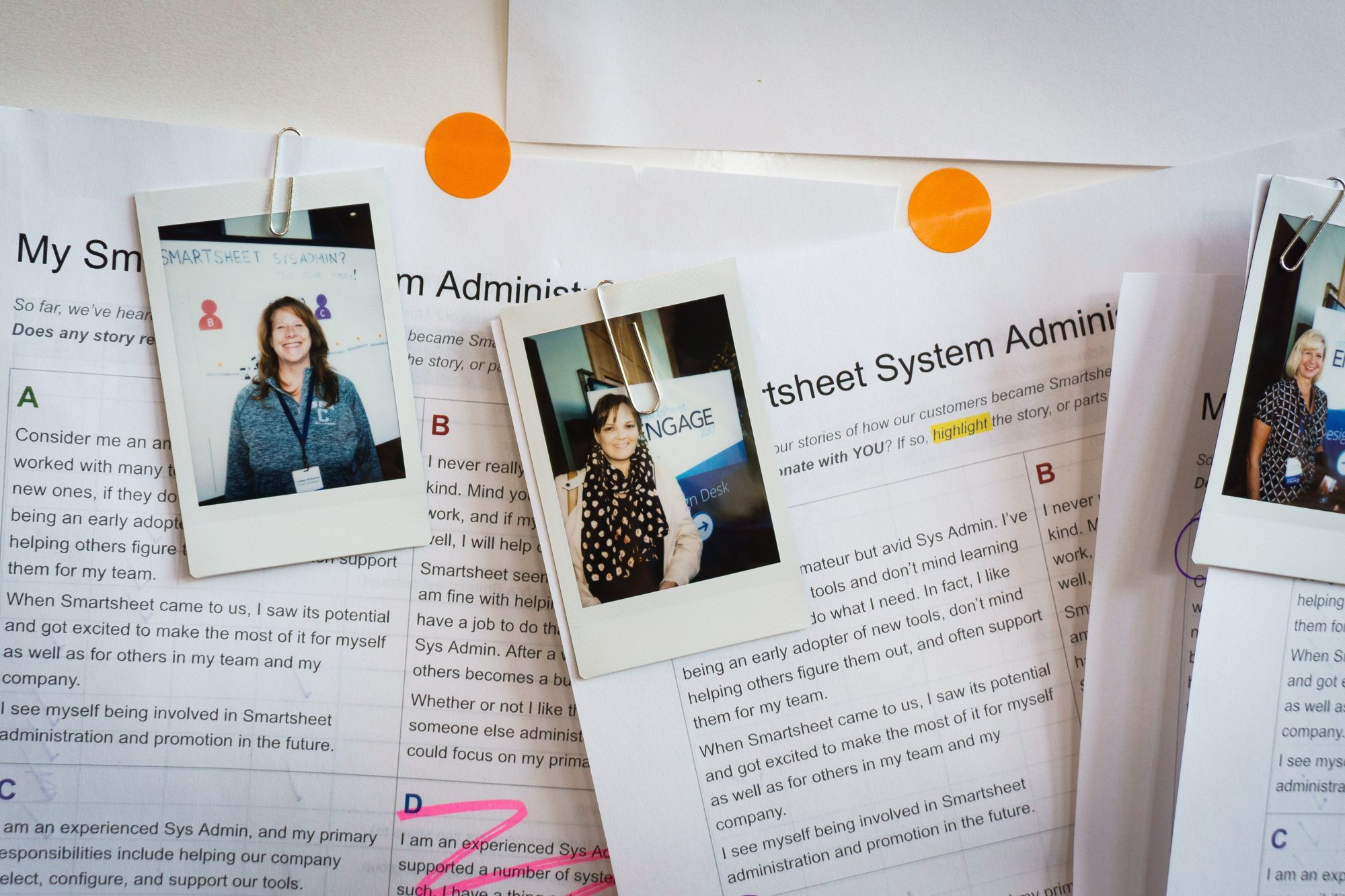 Instant photos of customers clipped to printed system admin persona stories, with highlights and orange dots