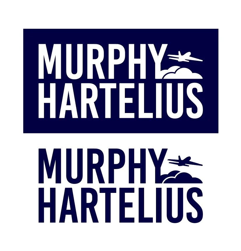 Murphy Hartelius logo with plane and clouds, reversed and positive in navy